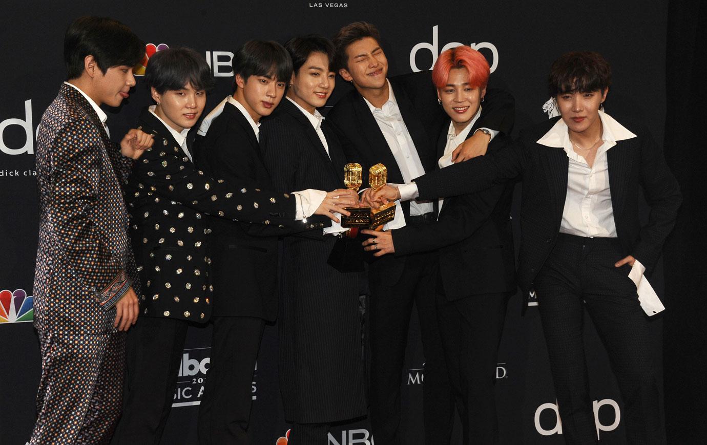 BTS group holding award j-hope bts cultural appropriation