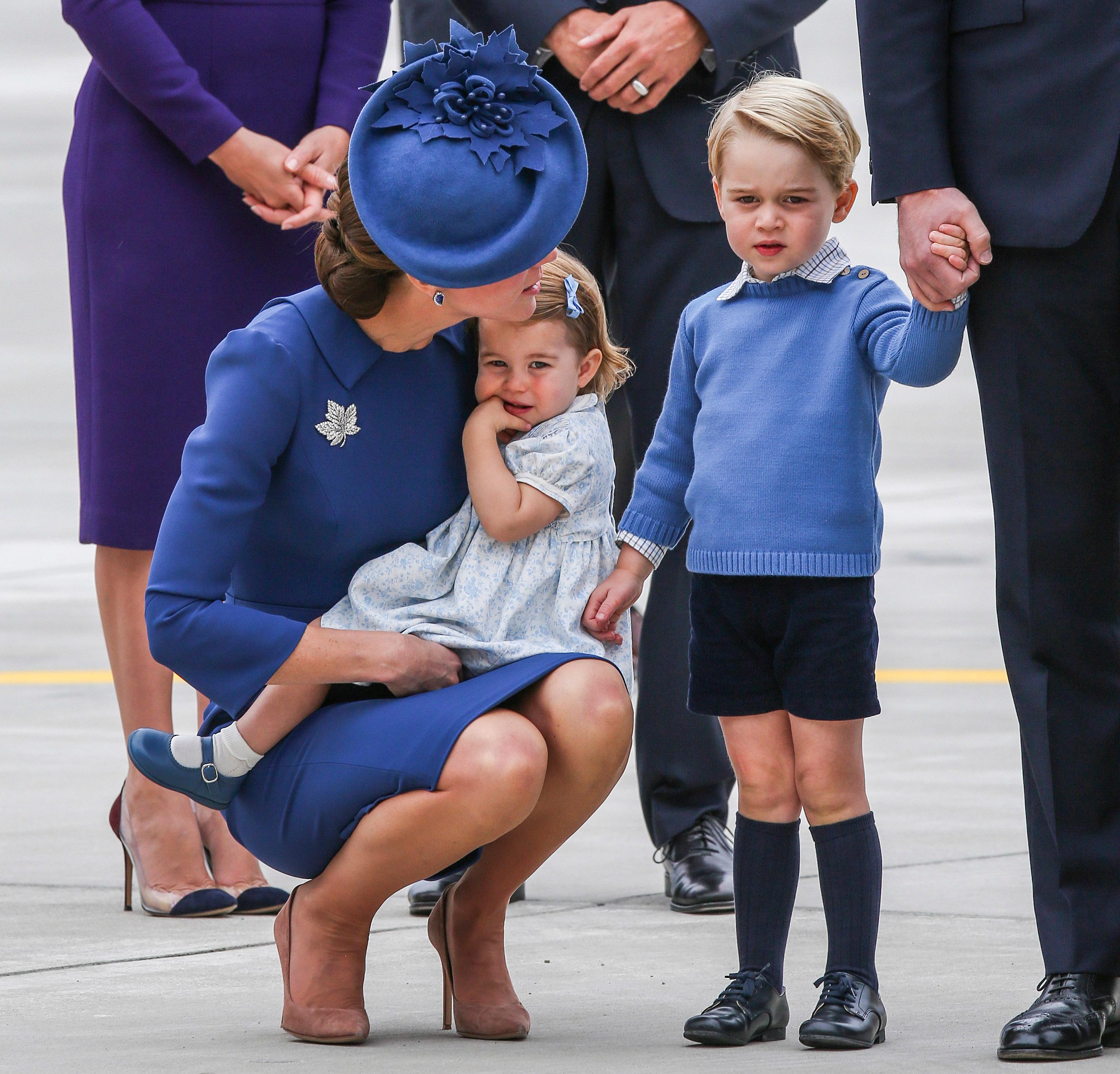 Prince George looks upset but Mum Kate comes to the rescue to cheer him up on trip to Canada