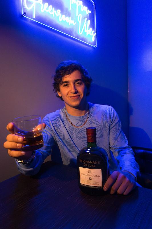 marcello hernandez toasts to ers with buchanans whisky backstage at his miami comedy shows