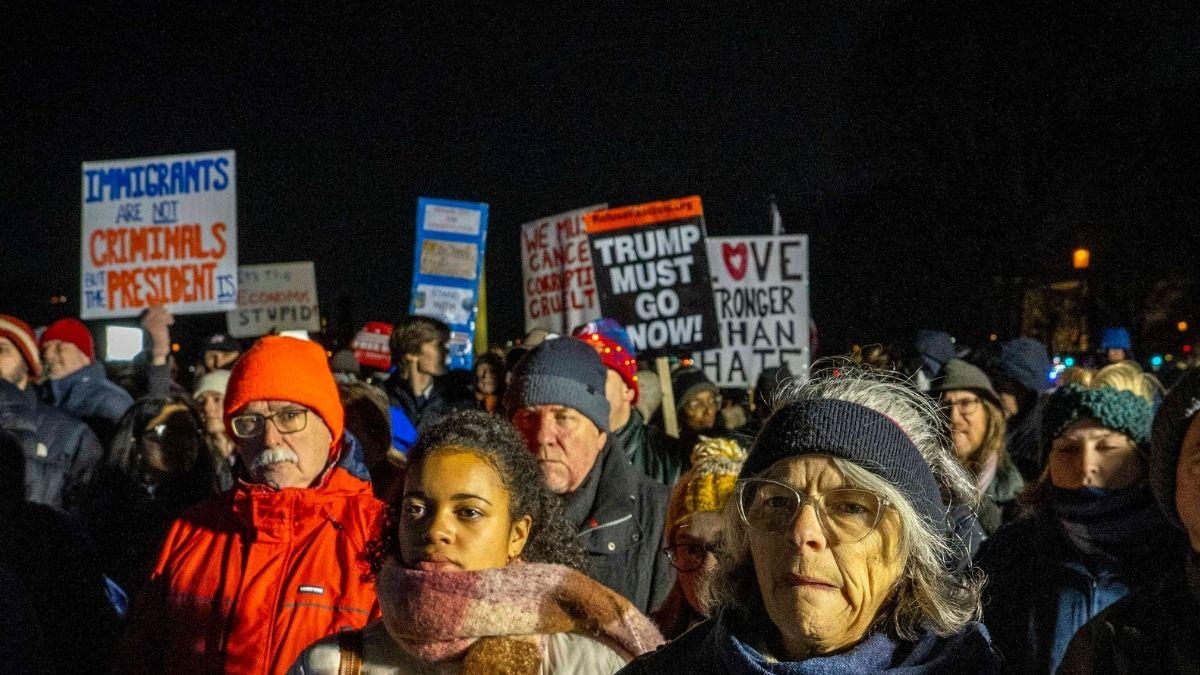Image of Attendees held signs that read ‘No Money for ICE’ and ‘Healthcare Not Warfare.’