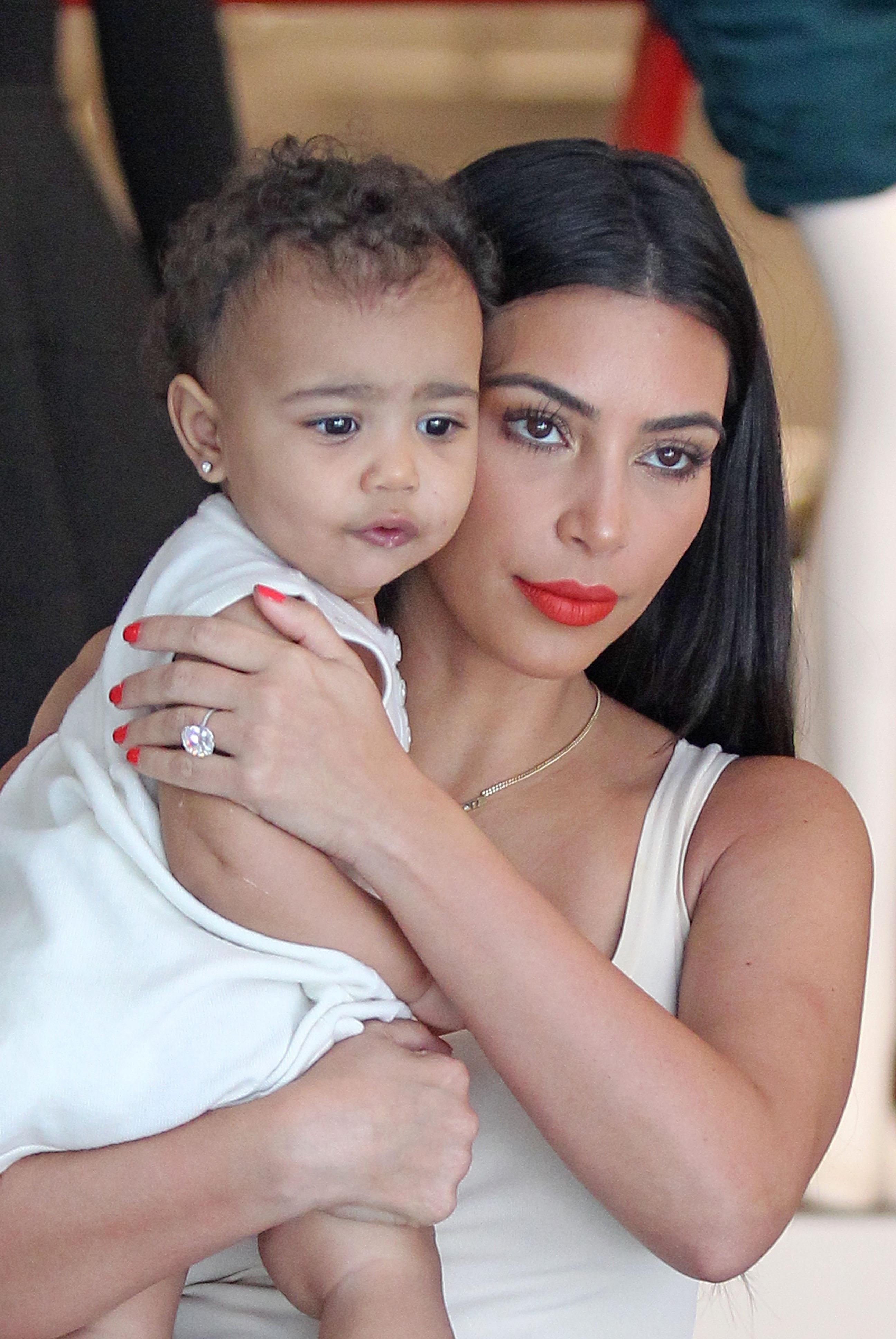 Kim Kardashian shows off her massive diamond wedding ring while carrying baby North in New York City