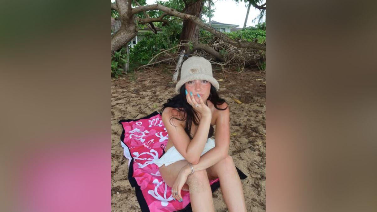 Image of Charli D'Amelio posed on the beach while in Hawaii.