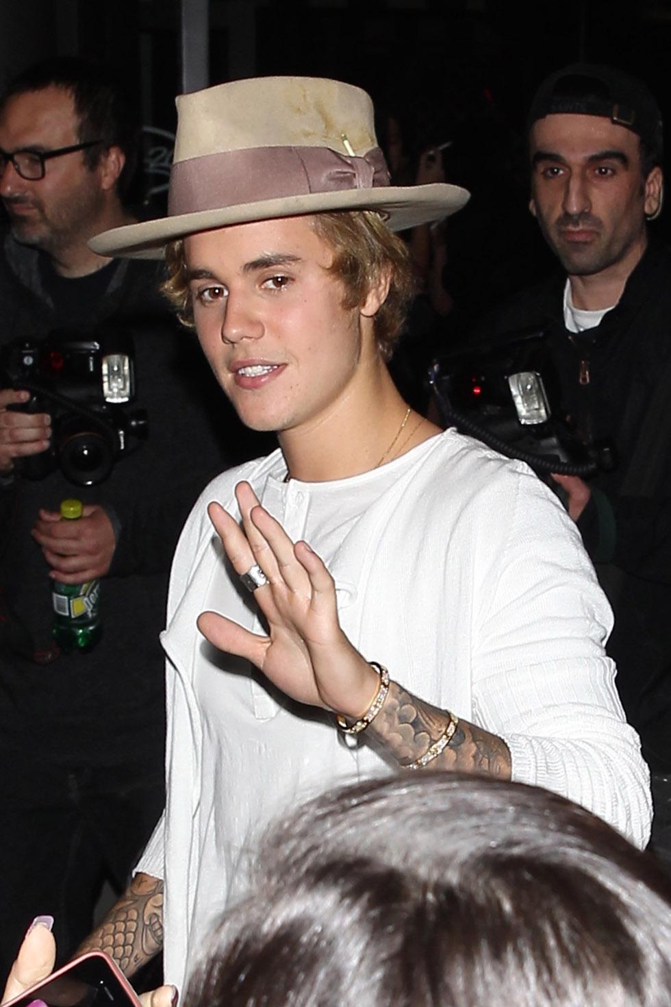 Justin Bieber greets a crowd of fans at Bar 20