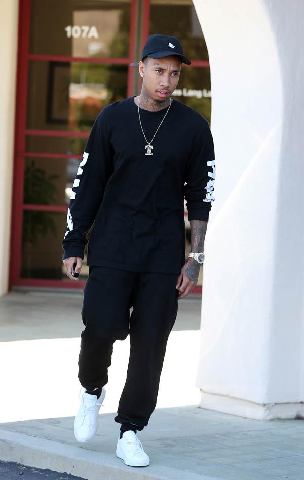 Tyga leaving US Bank in Calabasas and asked about Lamar Odom, Tyga said keep praying for him