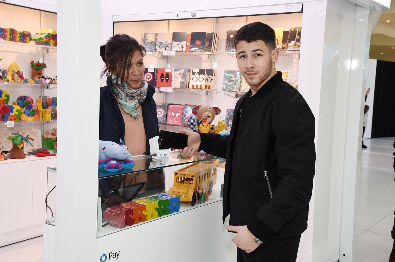 Nick Jonas celebrates the holidays at the Chase Pay Village