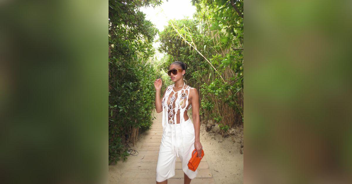 image of Lori Harvey shared a series of tropical vacation photos featuring a bold white crochet halter top that nearly resulted in a wardrobe malfunction.