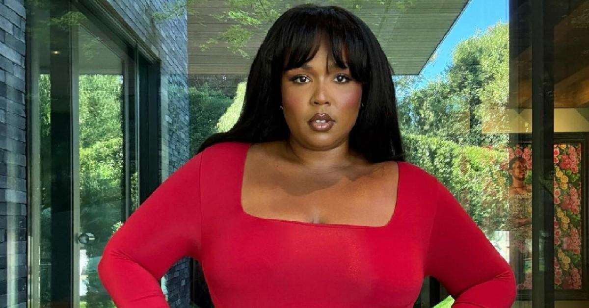 lizzo spills out sports bra celebrates weight release goal