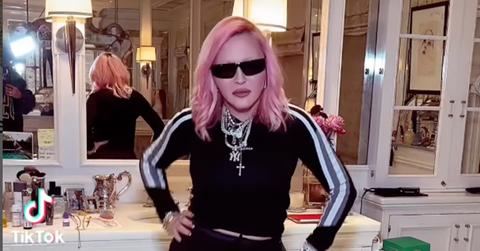 pink hair dont care madonna arrives at nyc airport with youthful new hairstyle pp