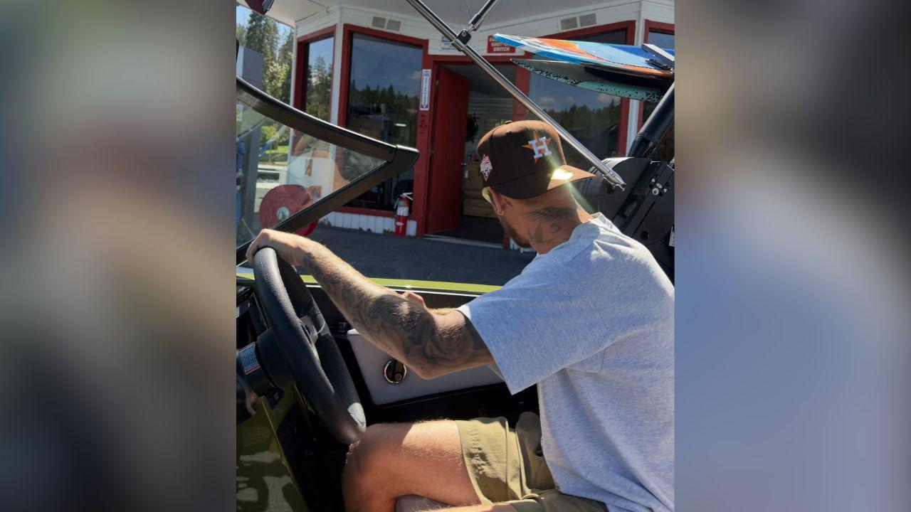 image of Justin Bieber kept his vacation look casual in tan shorts, a gray T-shirt and a dark baseball cap.