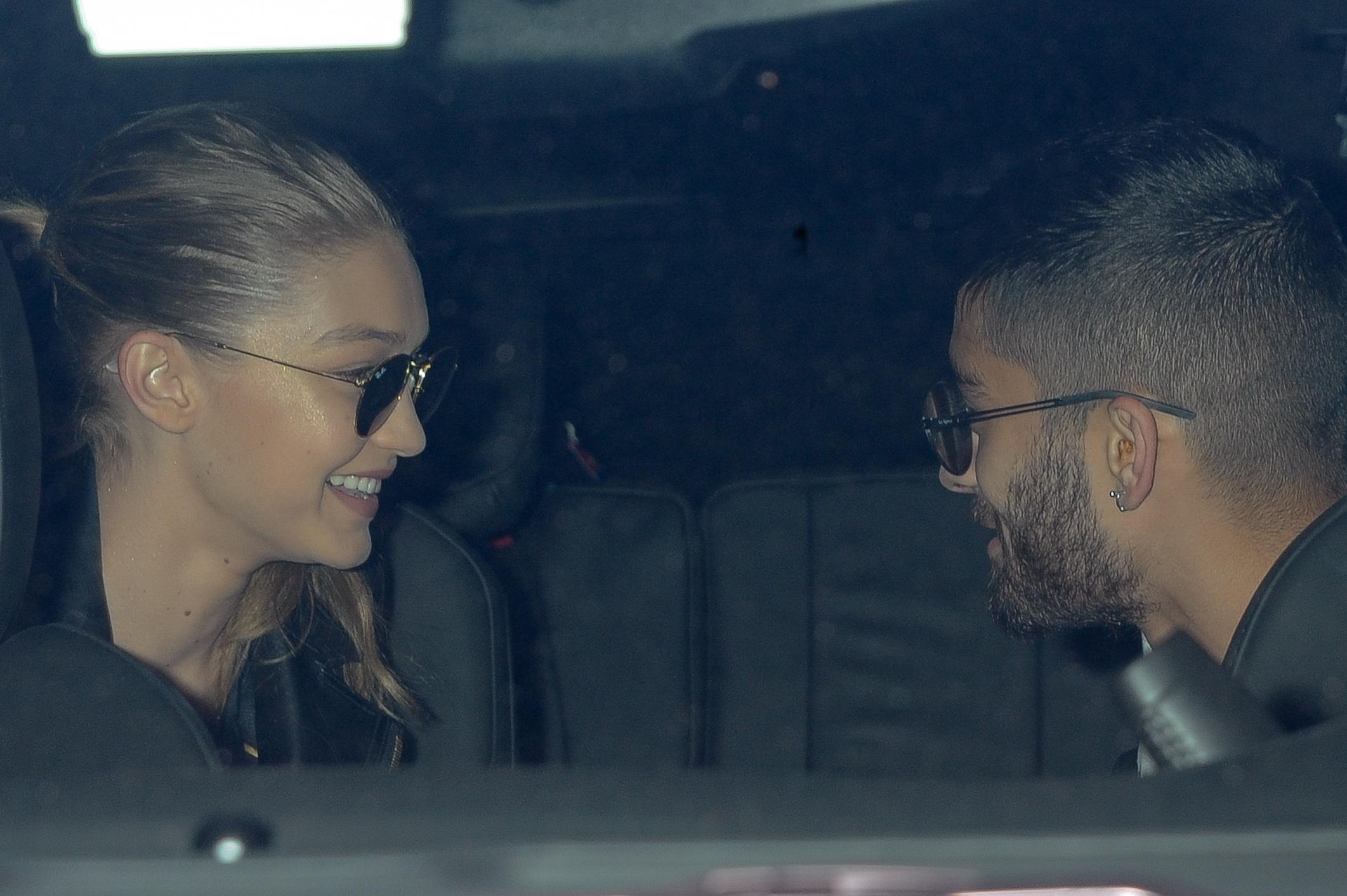 Gigi Hadid holds Zayn&#8217;s arms as they leave NYC apartment together.