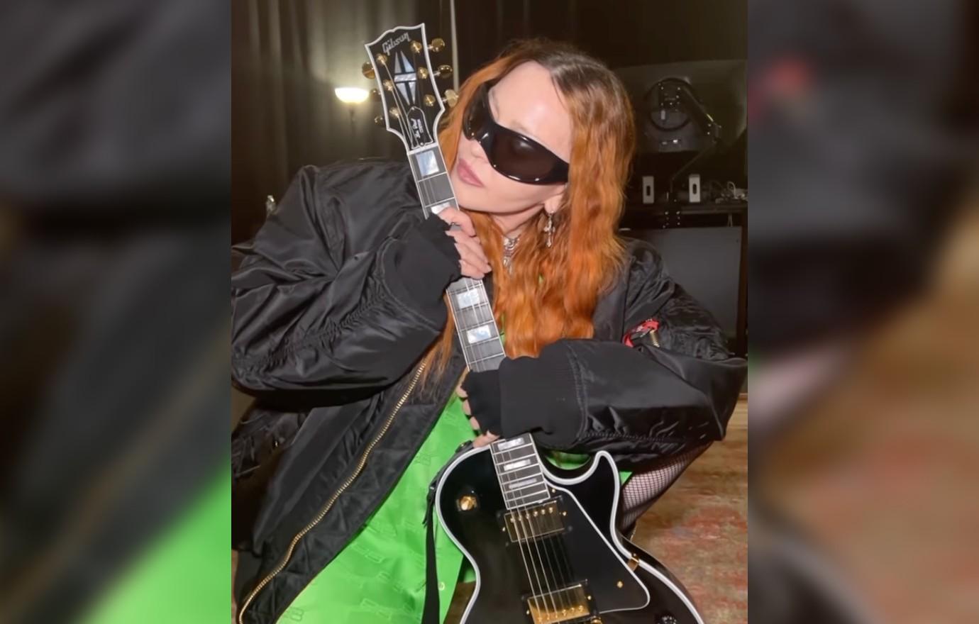 Madonna Called 'Nasty' & 'Trashy' By Fans For Video Licking A Guitar