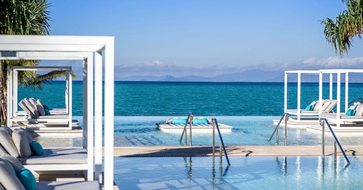 image of Set up a chair and lounge by one of the many pools. 
