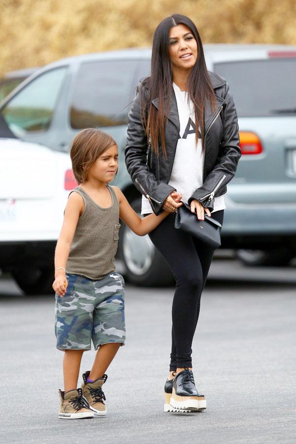 Kourtney Kardashian and little Mason get to work