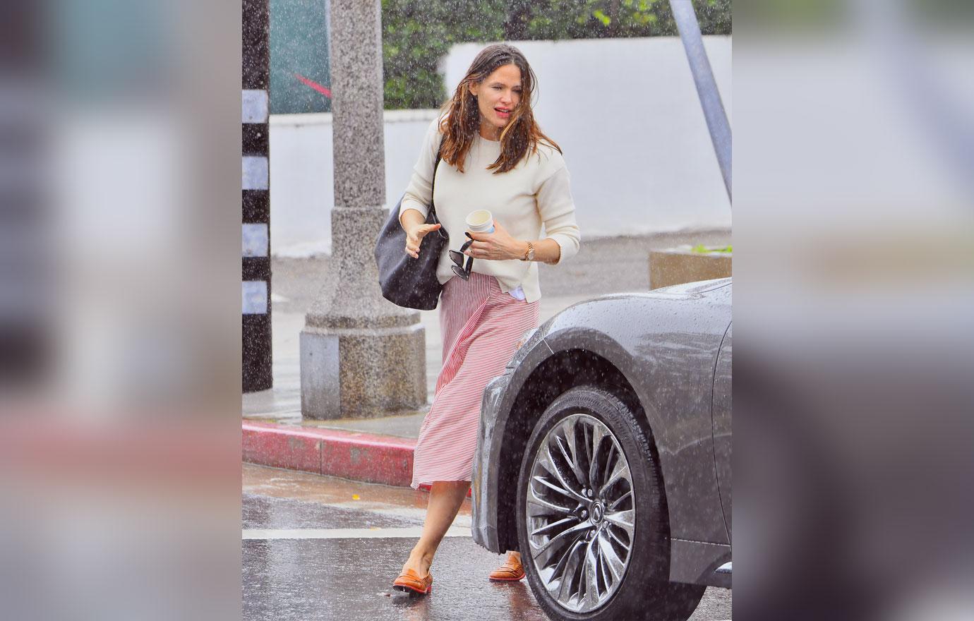 Jennifer Garner gets caught in the rain while leaving church