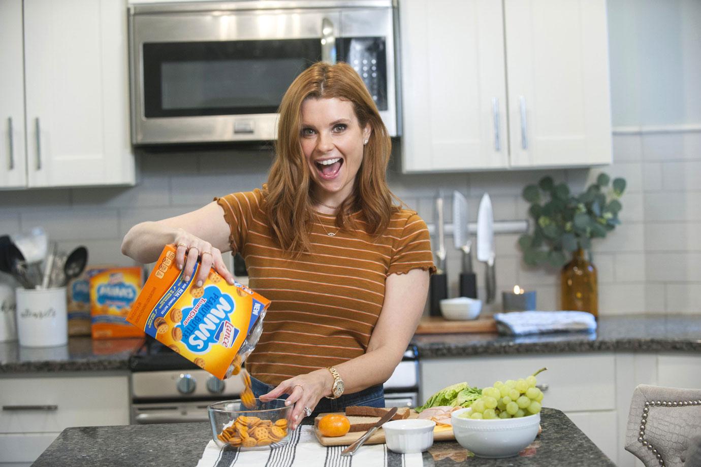 JoAnna Garcia Swisher packs after-school snacks for the family with Lance Minis at home on location in Atlanta, GA.