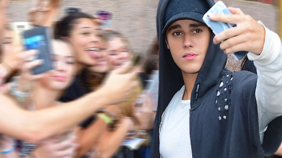 Justin Bieber charging fans for photos