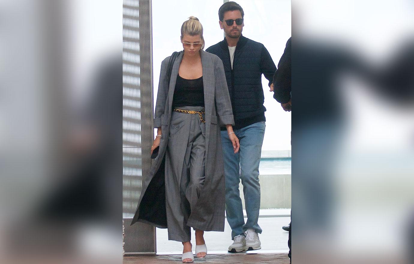 Sofia Richie Looking Down And Walking With Scott Disick