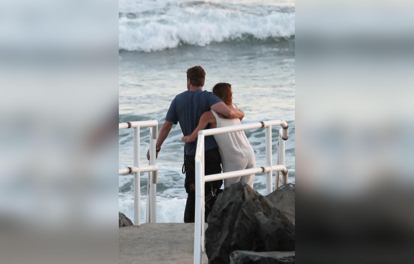 EXCLUSIVE: Gerard Butler and girlfriend Morgan Brown take a romantic stroll on the beach in Malibu, CA