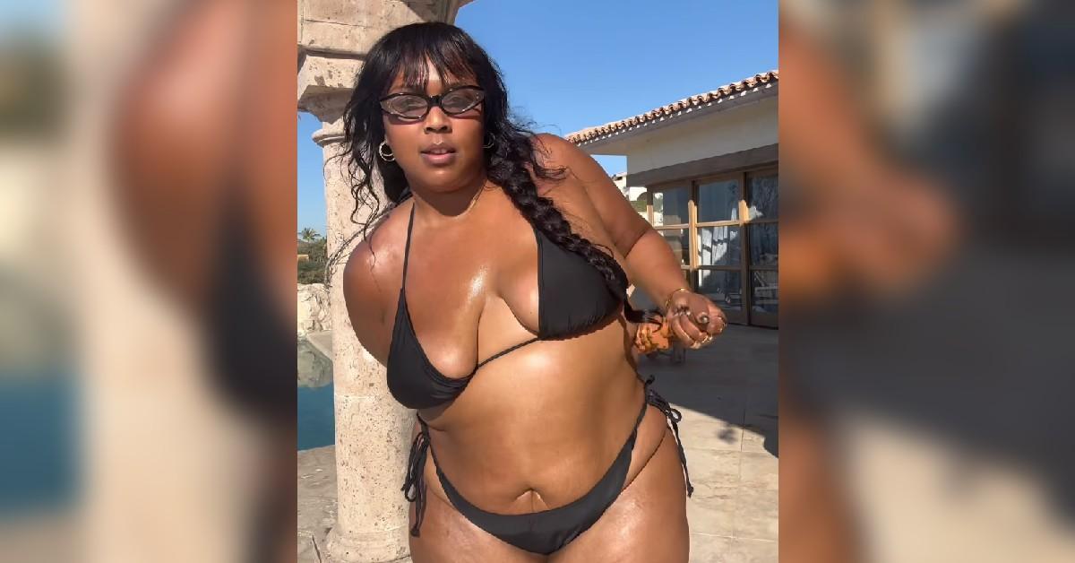 lizzo behind display black bra underwear weight loss journey photo