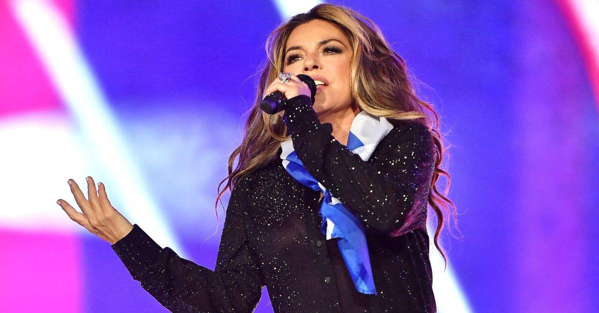 Photo of Shania Twain stunned in a sequin bra top while on stage.