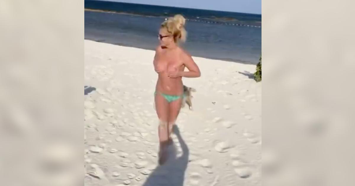 britney spears runs topless falling sand resurfaced viral video watch