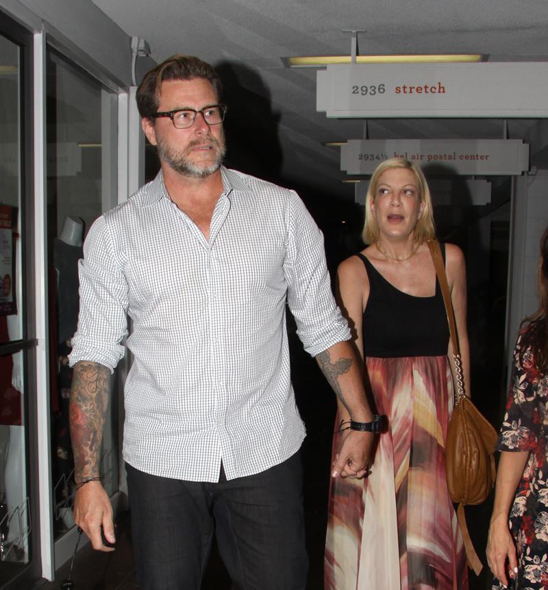 *EXCLUSIVE* A makeup free Tori Spelling and Dean McDermott hold hands at dinner