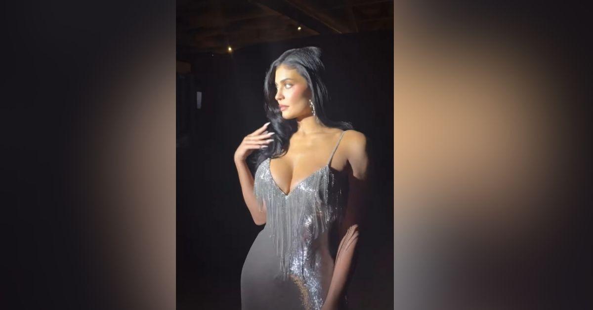 image of Kylie Jenner stunned in a silver gown at Paris Fashion Week.