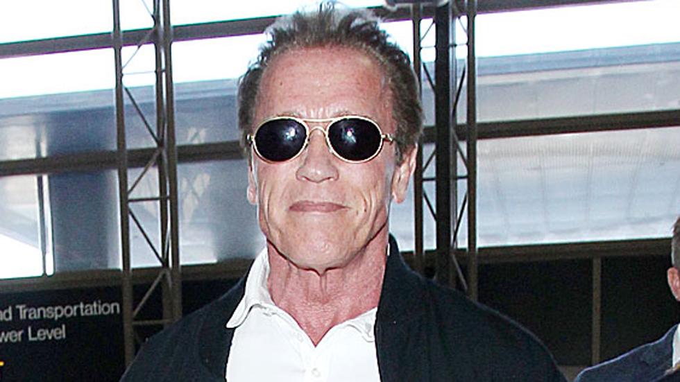 Arnold Schwarzenegger arrives at the Los Angeles International Airport **NO DAILY MAIL SALES**