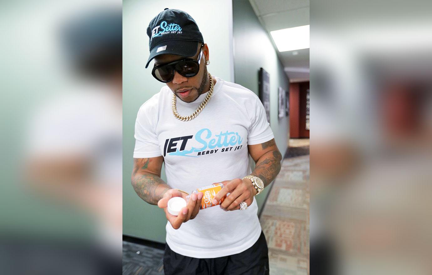 Flo-Rida pauses between radio interviews to pop a Jet Setter CBD Infused Gummy