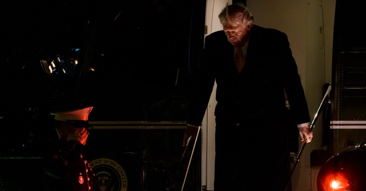 Photo of The president used both handrails when he exited a helicopter.