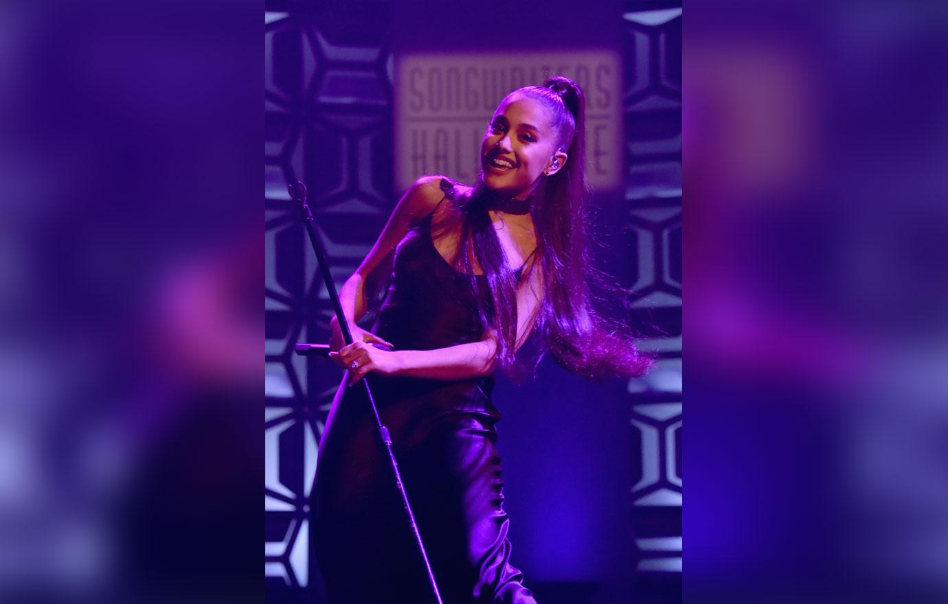 Ariana smiling onstage