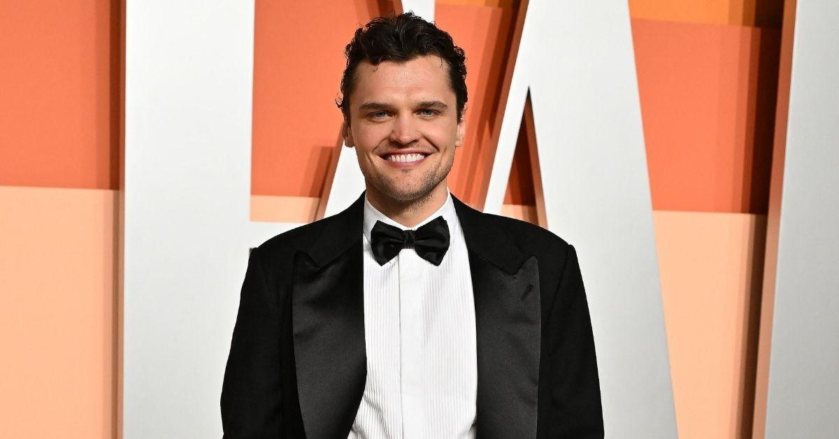 image of Ray Nicholson smiled brightly beside them in the pic.