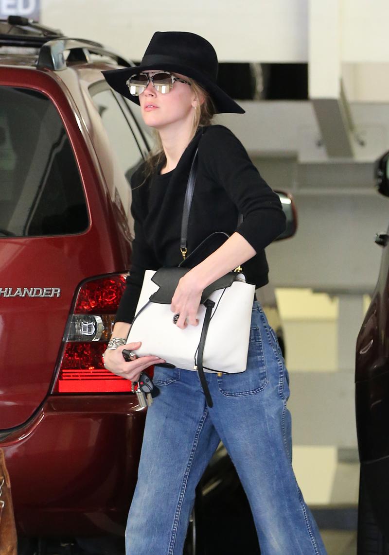 Amber Heard walking into a lawyers office in Beverly Hills