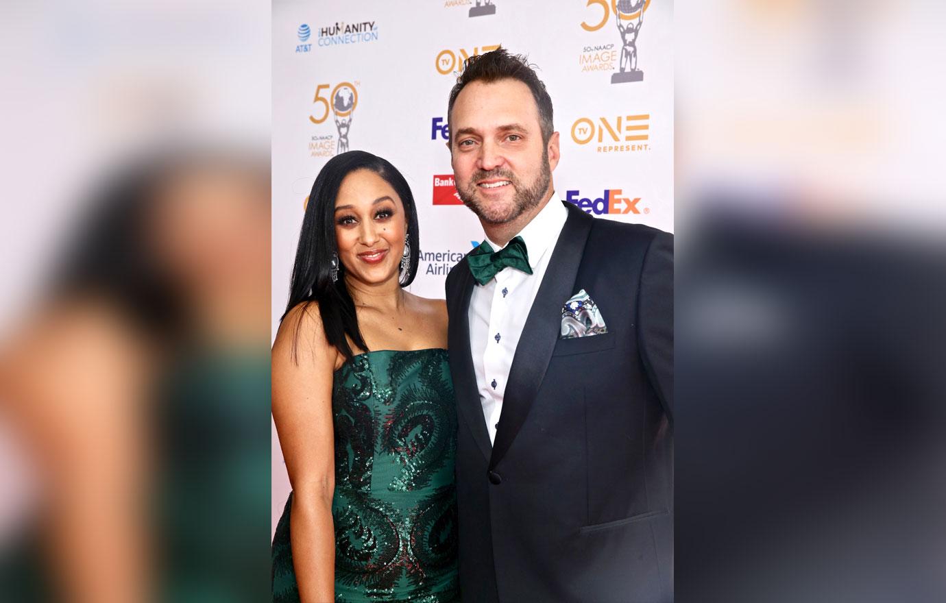 Tamera Mowry Wearing Emerald Green Dress With Adam Housley