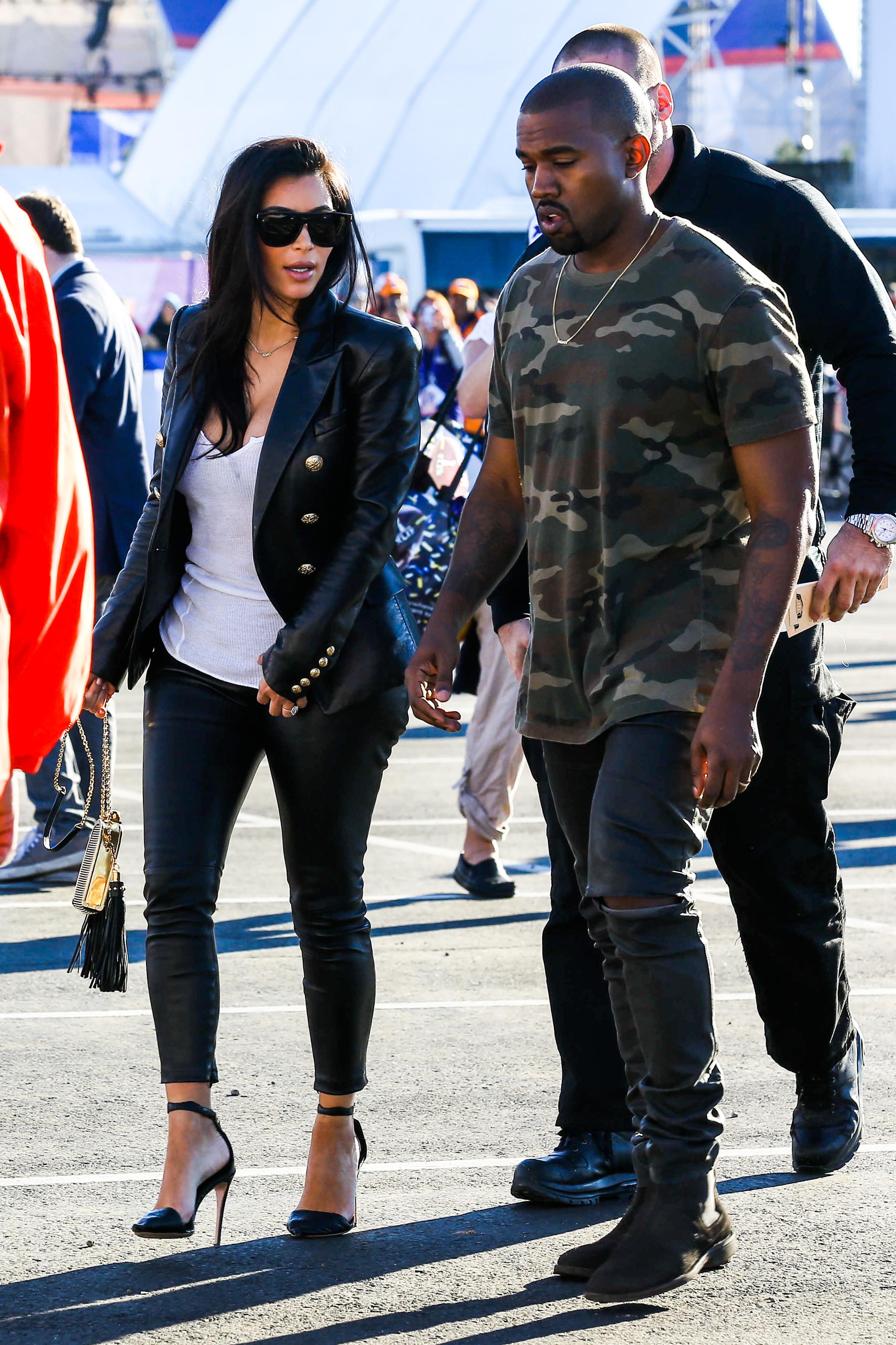 Kim Kardashian and Kanye West arrive for the Super Bowl XLIX