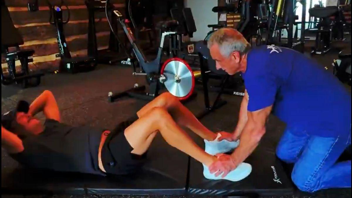 image of Shirtless RFK Jr. powered through an intense workout in the stylized montage.