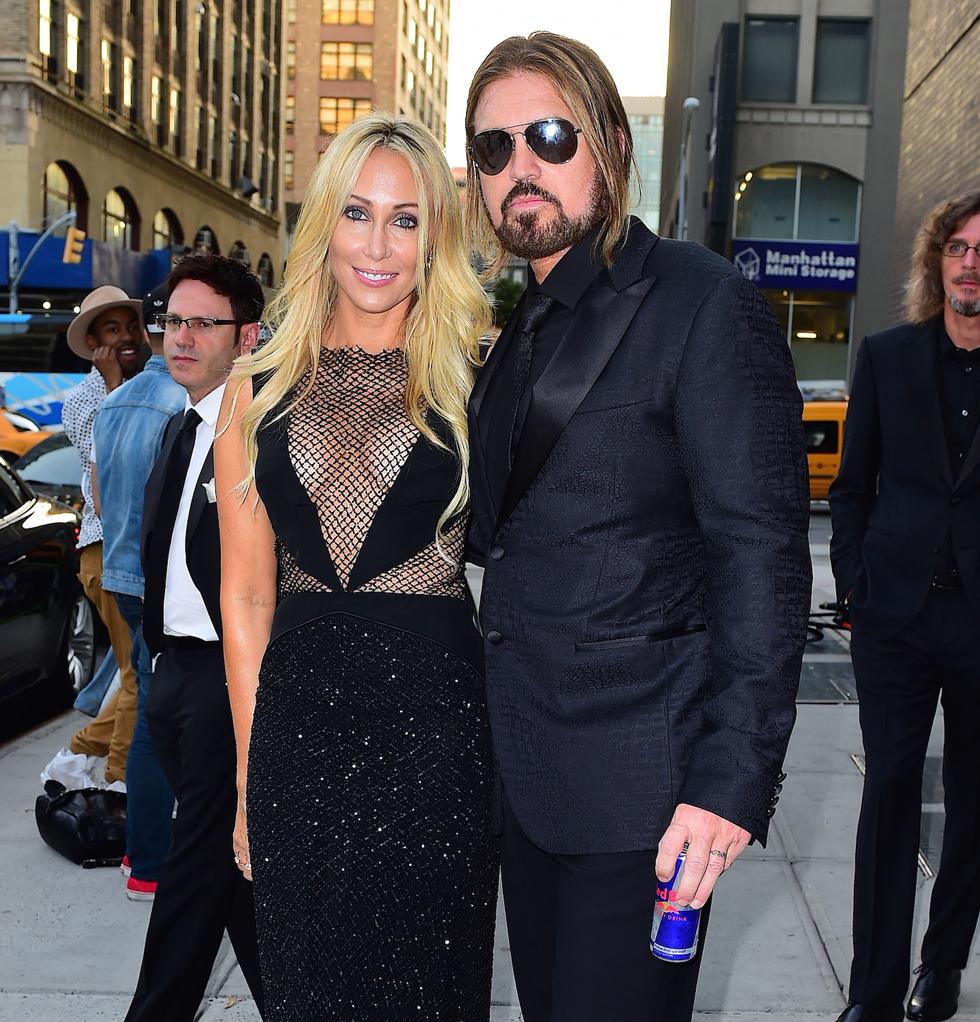 Billy Ray Cyrus and Tish Cyrus pose before the AmFar Inspiration Gala