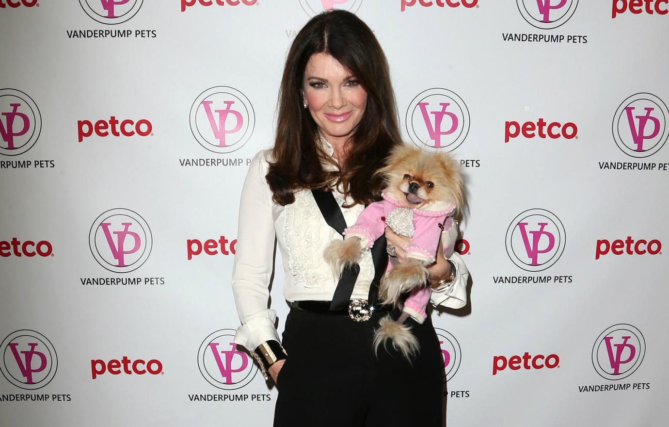 Lisa Vanderpump held Giggy at an event where the pup wore a luxurious pink outfit!