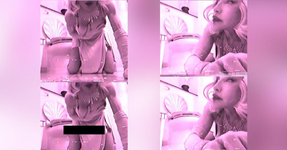 image of In the clip, the singer appears in a pink-tinted setting wearing a silky outfit with dramatic, stylized movements.