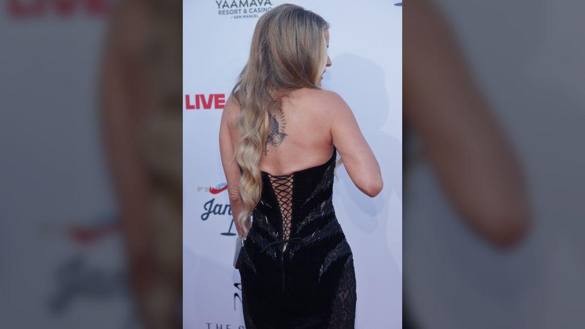 Photo of Carmen Electra showed off her back tattoo during Grammys weekend.