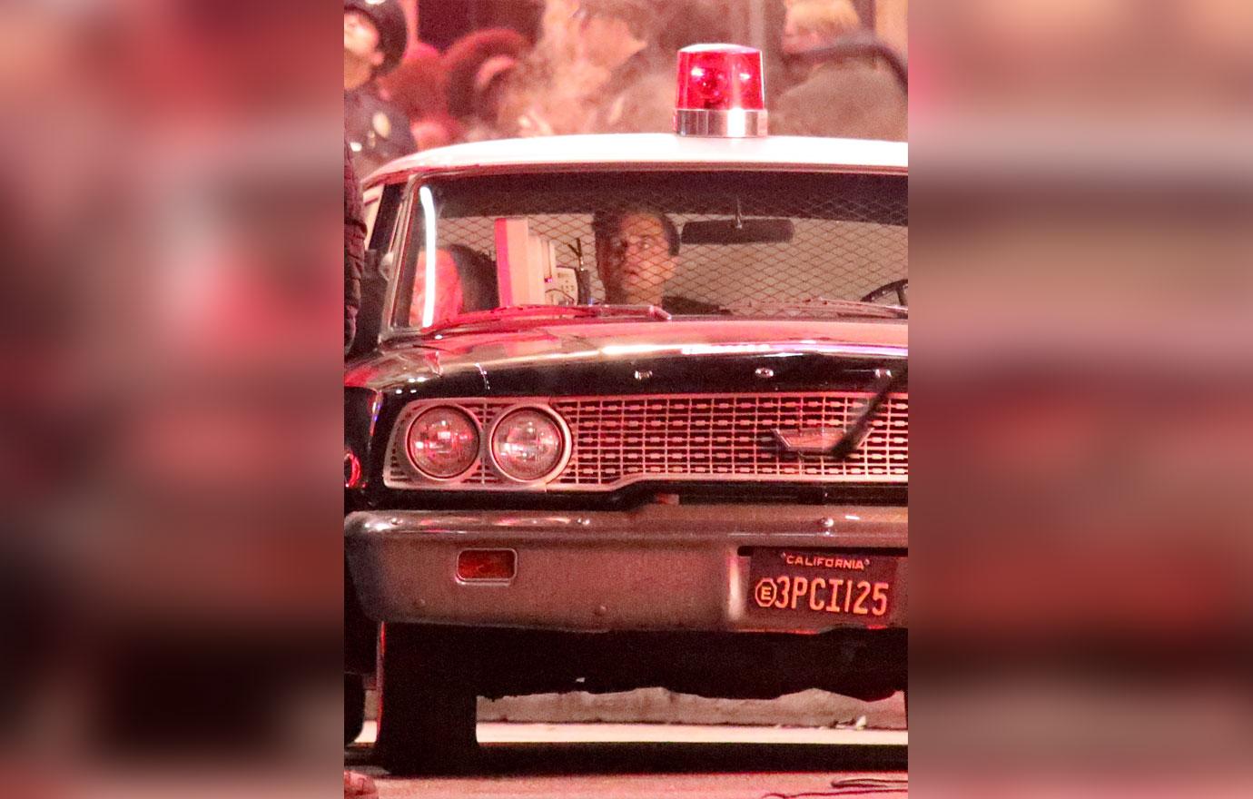 EXCLUSIVE: Leonardo Di Caprio crashes car and is put into police car film scene for Once Upon a Time in Hollywood