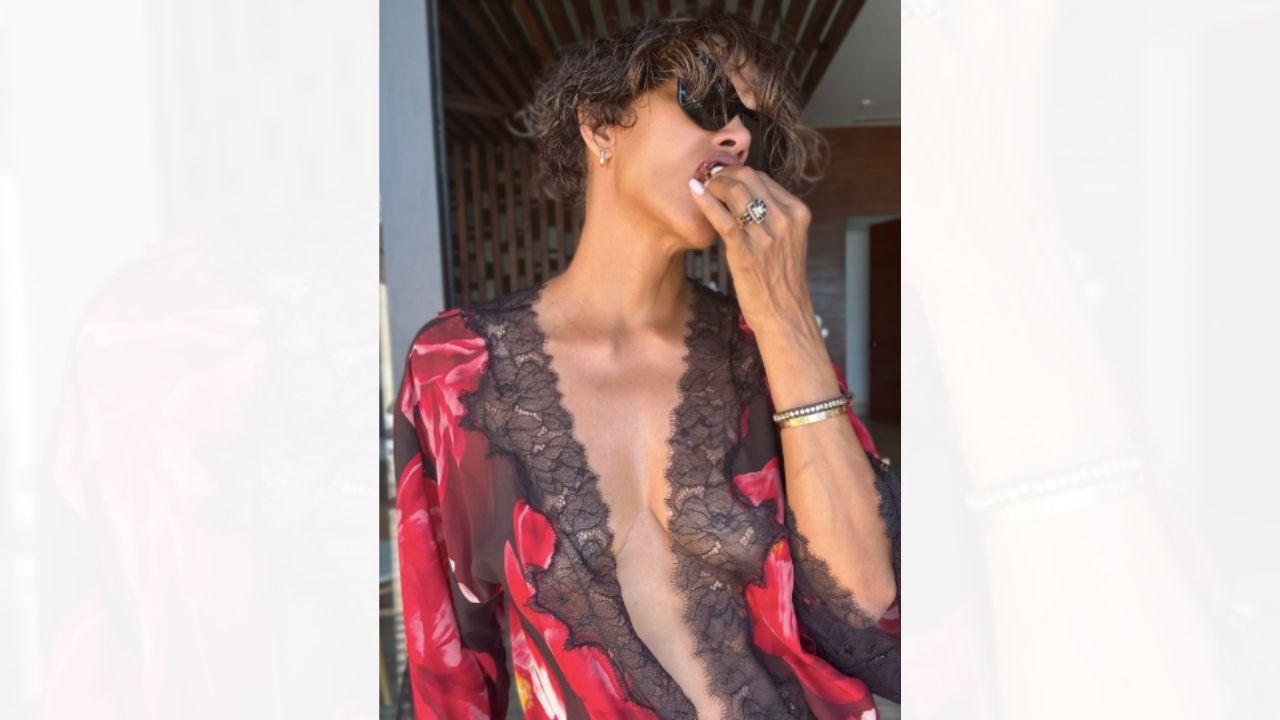 Image of Halle Berry wore hot red lingerie as she posed for the sultry snaps.