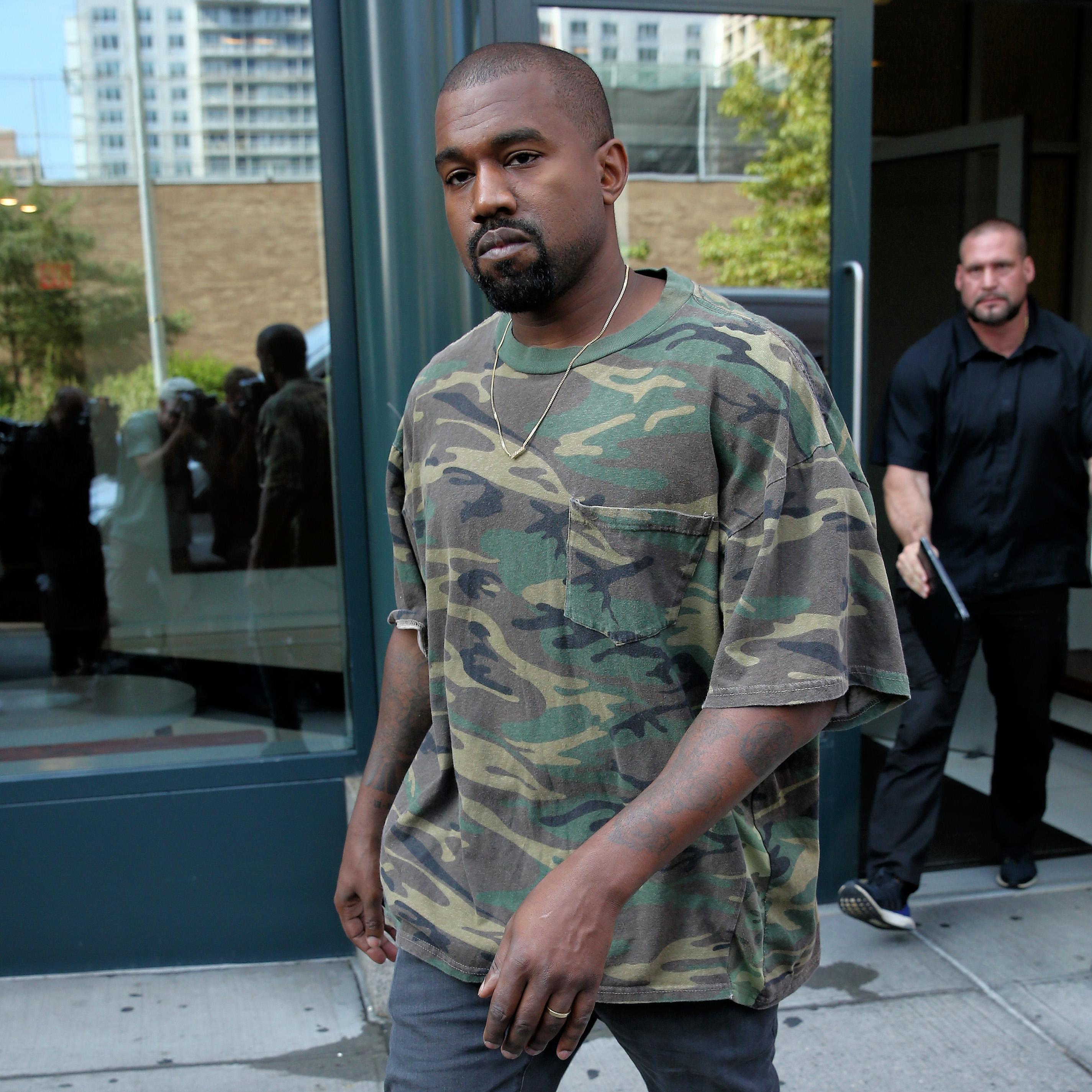 Singer Kanye West leaves his apartment in New York City