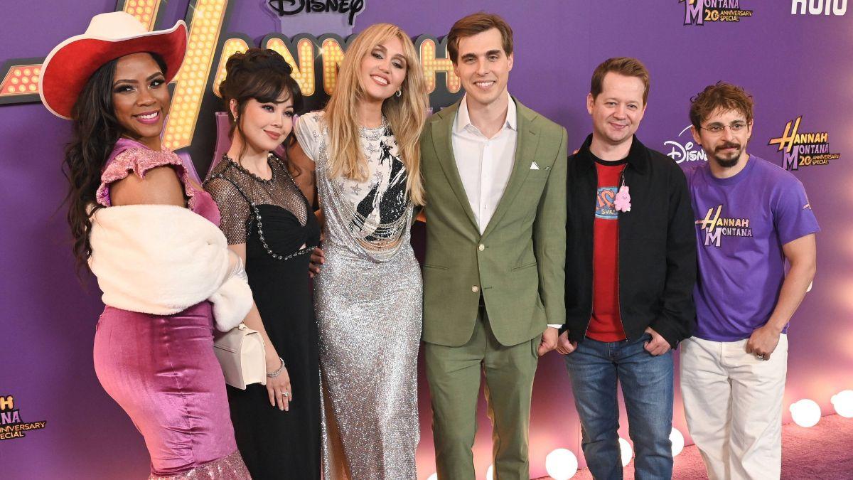 Photo of Miley Cyrus reunited with many of her former 'Hannah Montana' costars at the premiere on March 23.