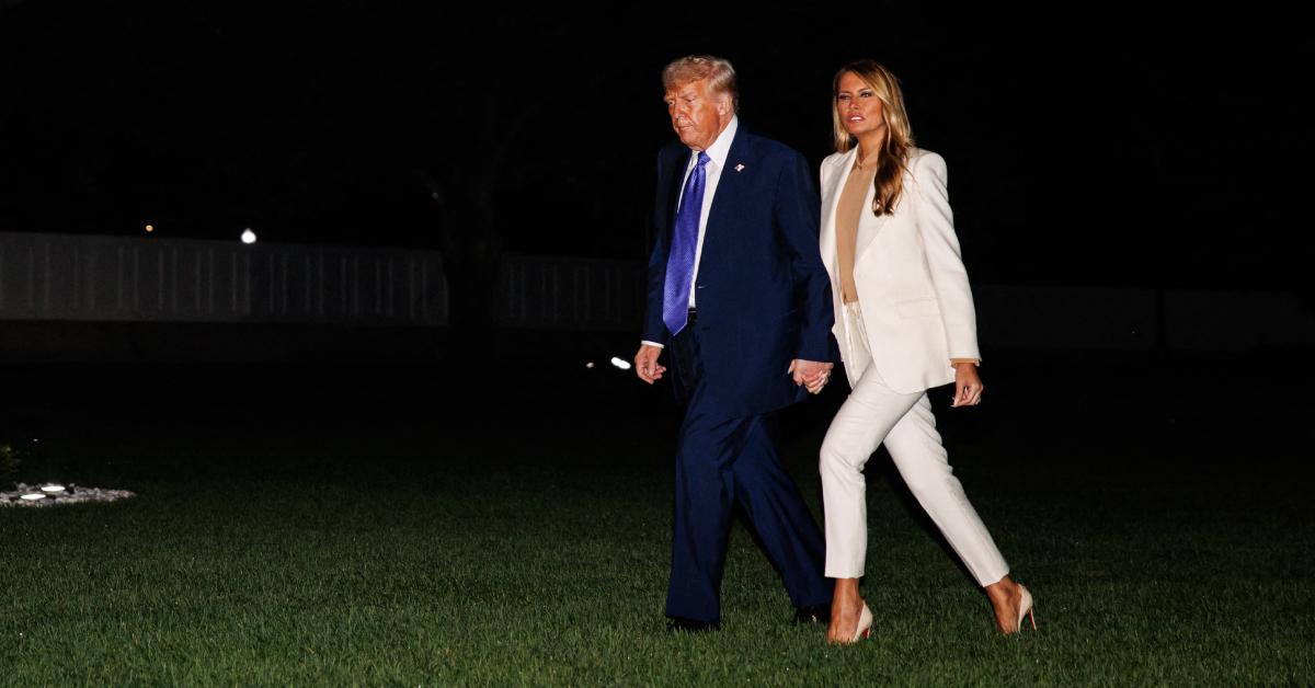 Image of Donald and Melania Trump held hands after their animated conversation.