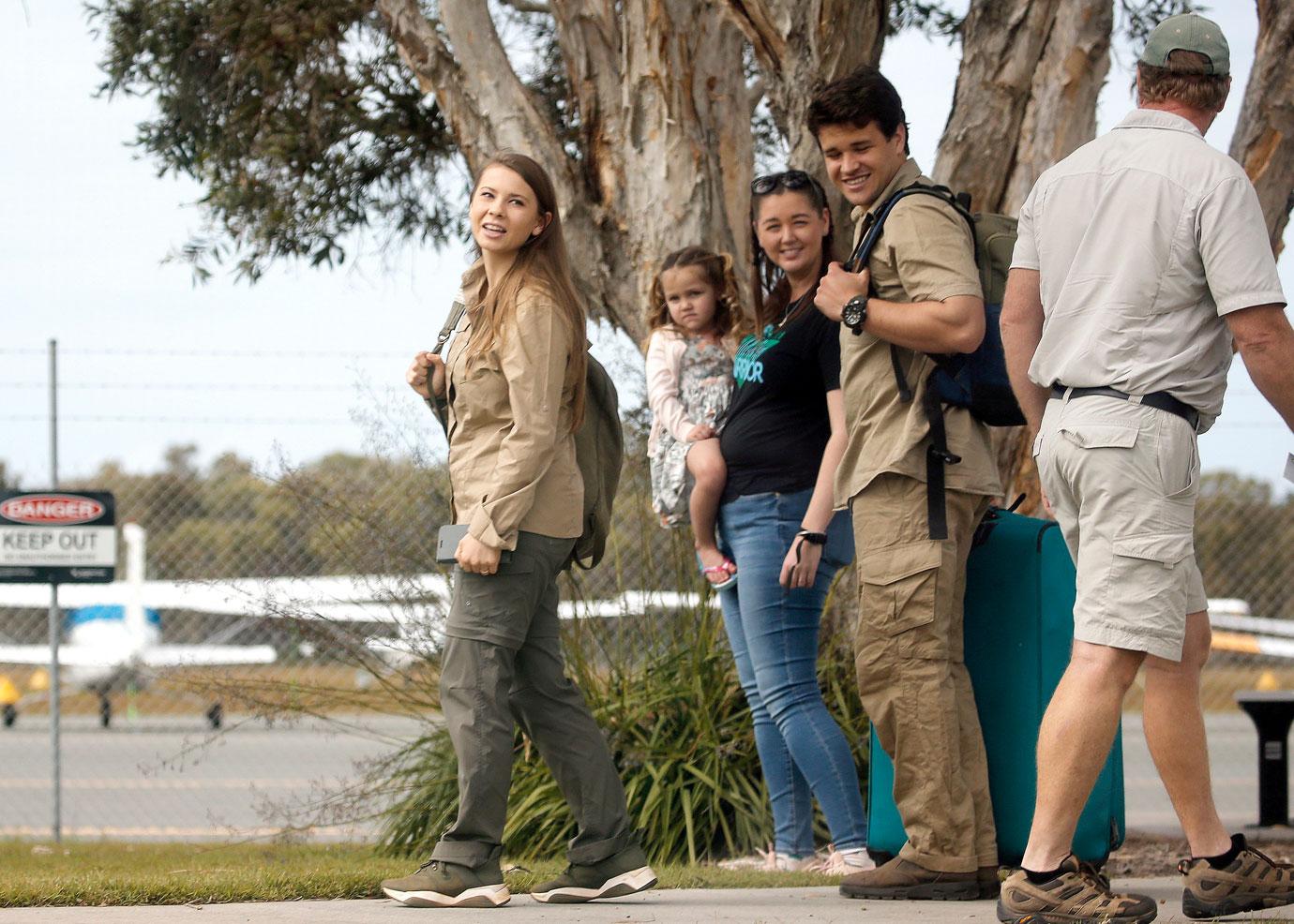 Pregnant Bindi Irwin and Chandler Powell at airport on the anniversary of Steve Irwin's death