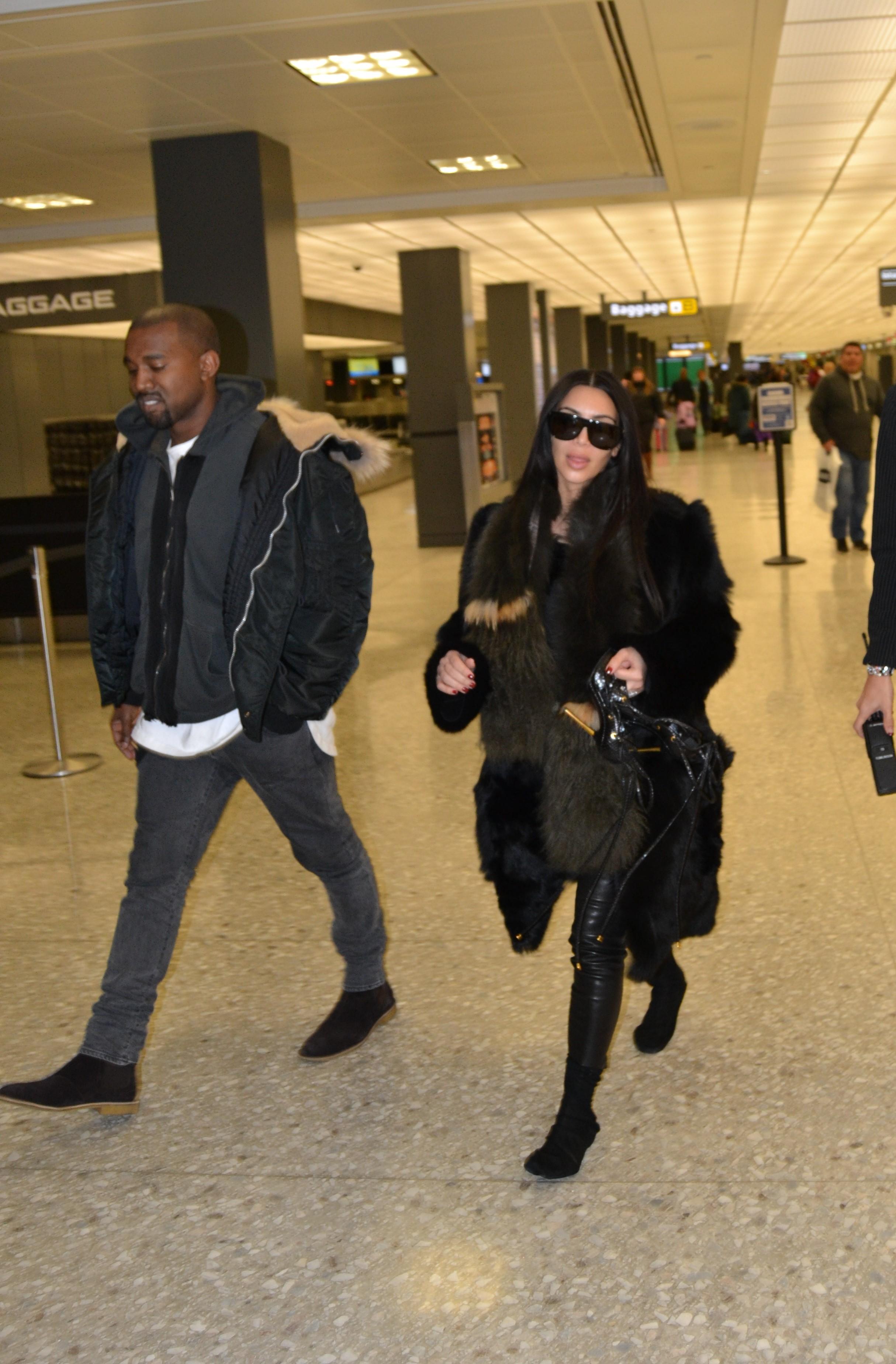 Kim Kardashian and Kanye West leaving D.C. after the 2015 BET Honors Show