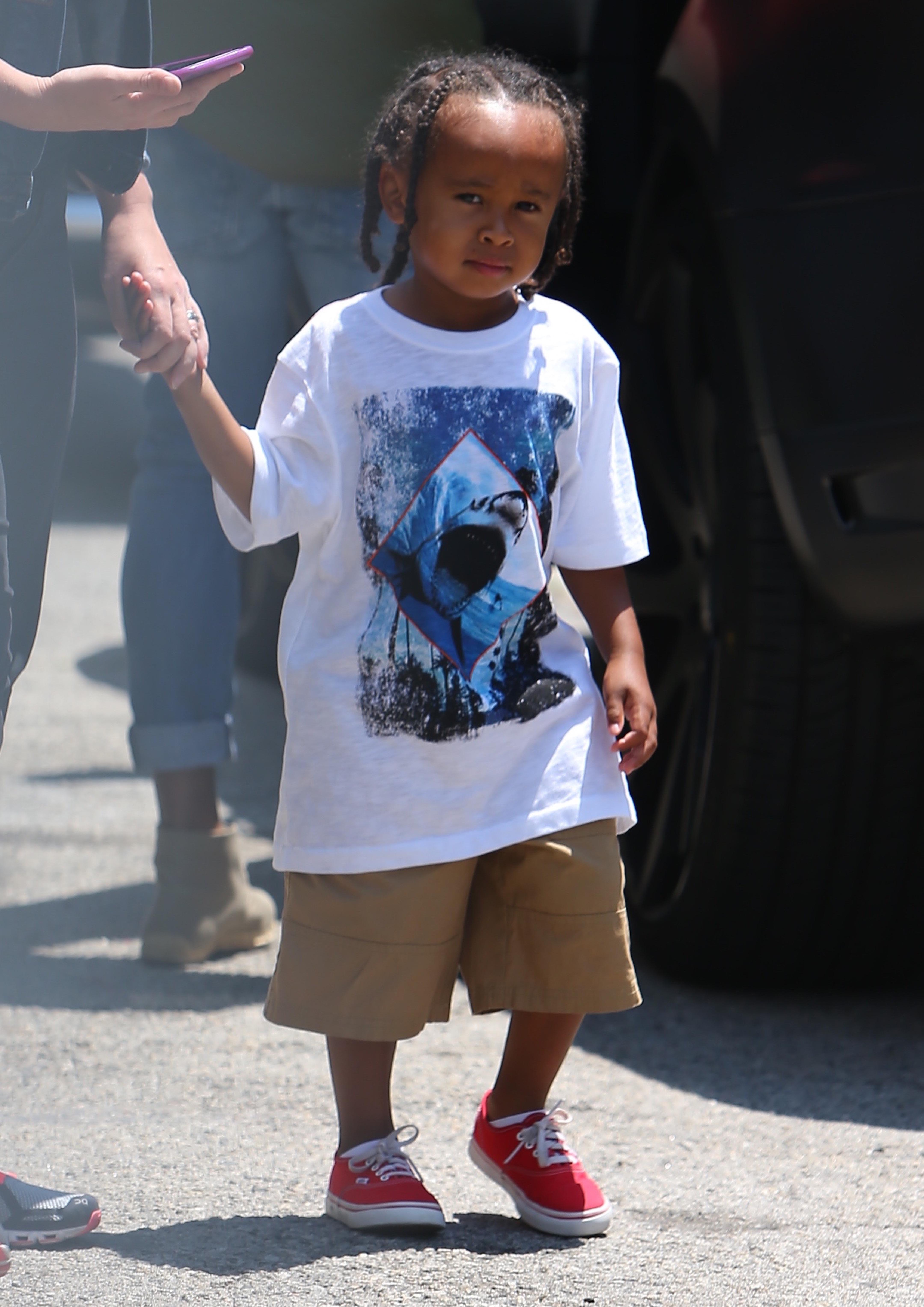 Blac Chyna&#8217;s son King Cairo Stevenson is walked into a recording studio by a handler while his mother waits to be covered up by a production crew while filming.