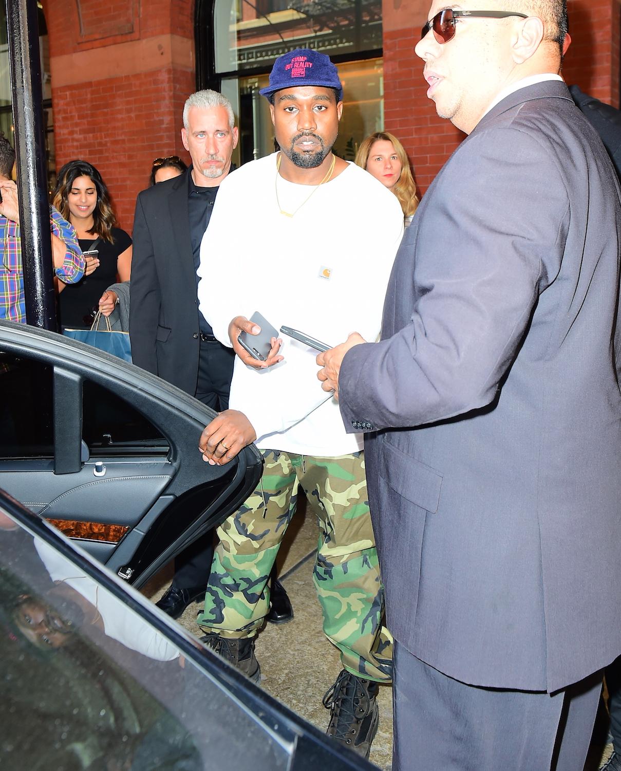 Kanye West Wears a &#8220;Saint&#8221; Gold Chain as he leaves a Meeting at the Mercer Hotel