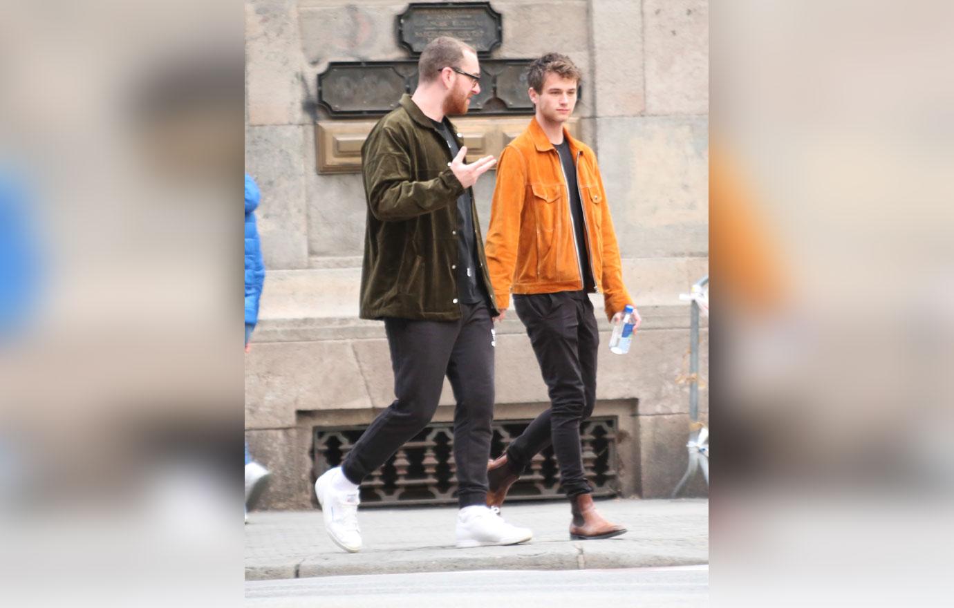 EXCLUSIVE: Sam Smith and boyfriend Brandon Flynn head out to dinner in Barcelona